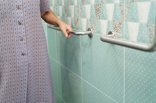 Secure grab bar support in a tiled walk-in shower
