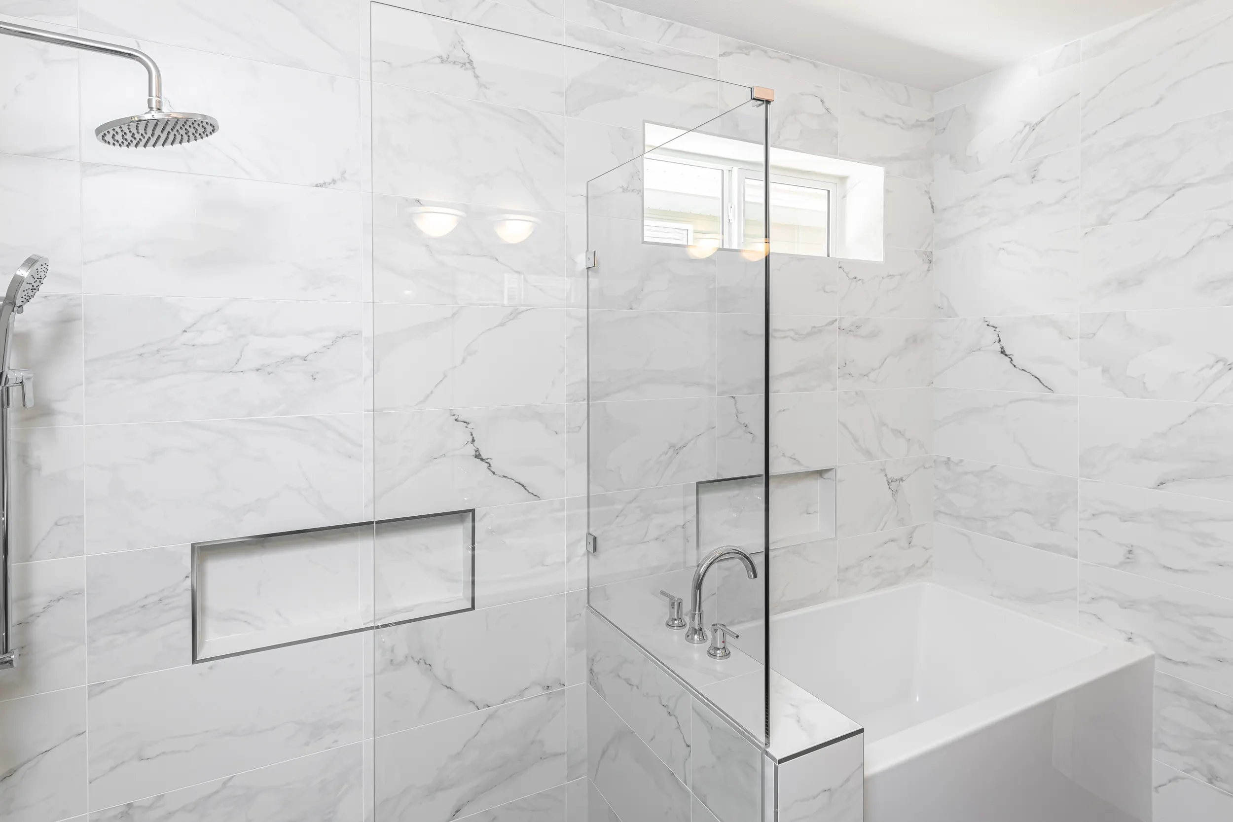 Marble-tiled spa ensuite with double vanity in Chilliwack by Master Painting & Renovations