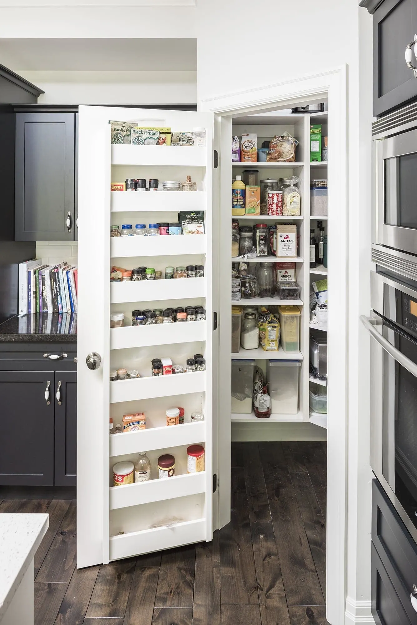 Refreshed grey and white kitchen with painted cabinets and bright white trim