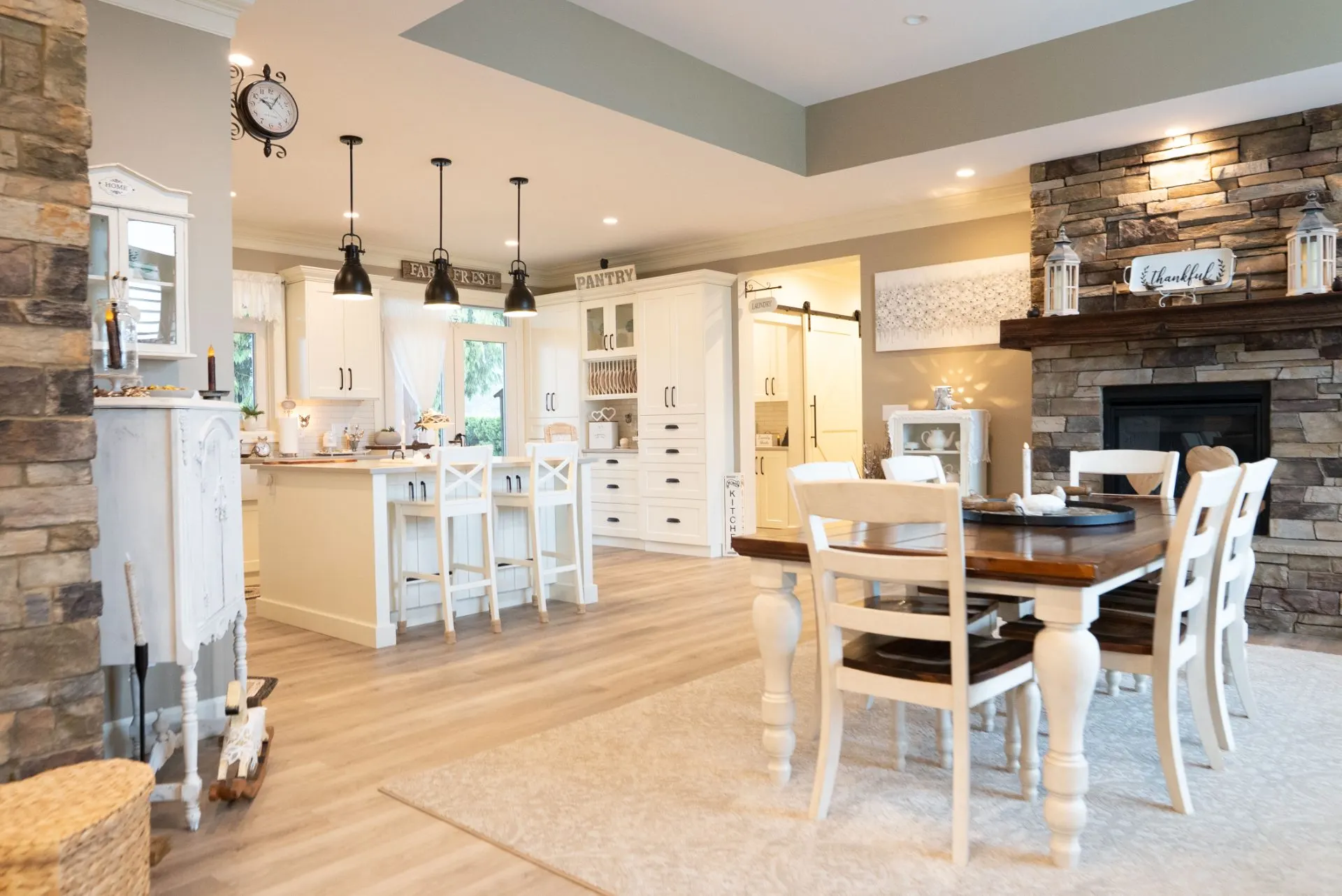 Renovated open-concept farmhouse kitchen and dining room by Master Painting & Renovations, Chilliwack BC