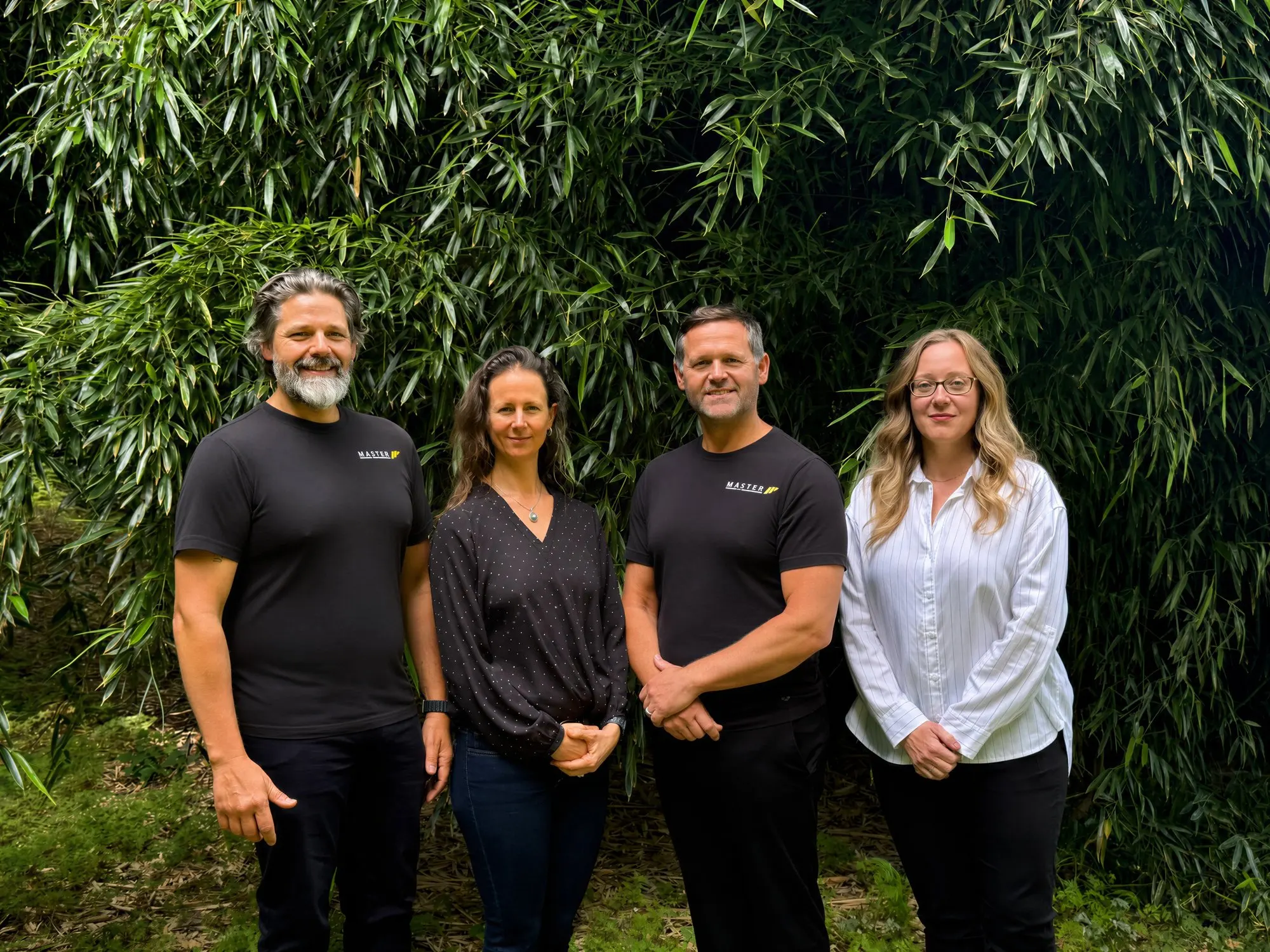 The Master Painting & Renovations team outdoors, left to right: founder Dave Waldner, Amy, Jon, and designer Hannah
