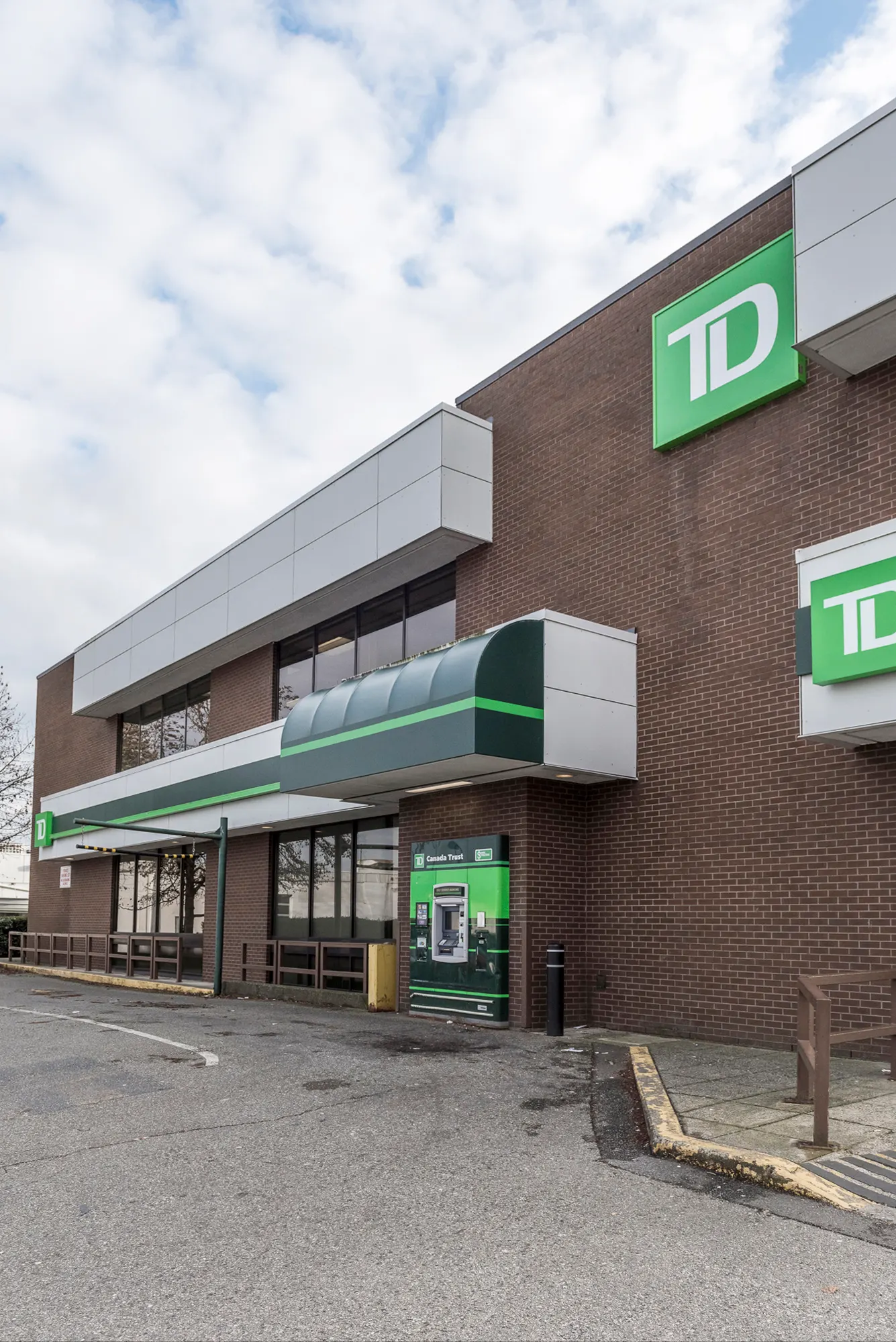 Drive-up ATM under a green awning at the TD Bank branch