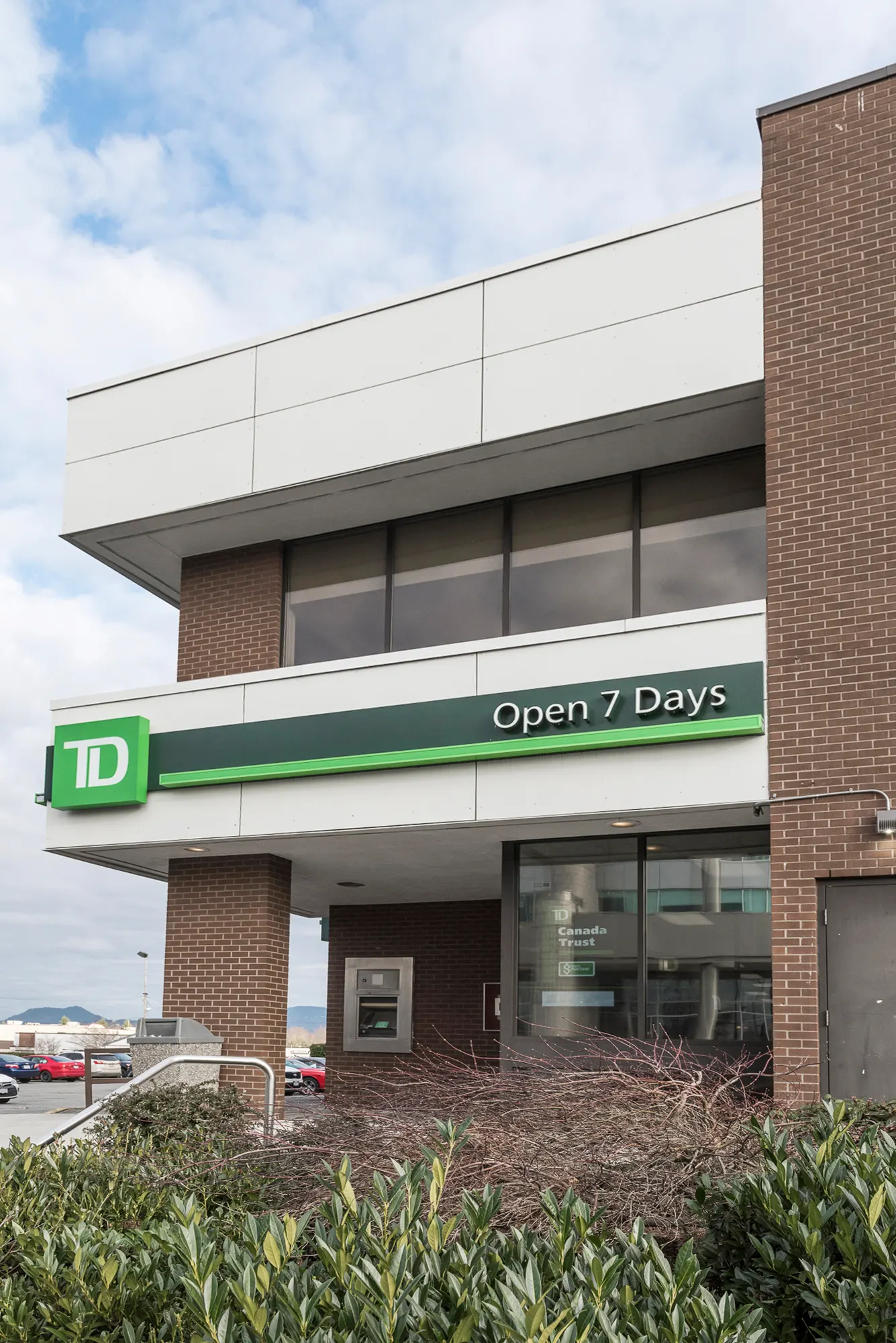Close view of the TD sign and Open 7 Days band over the branch entrance