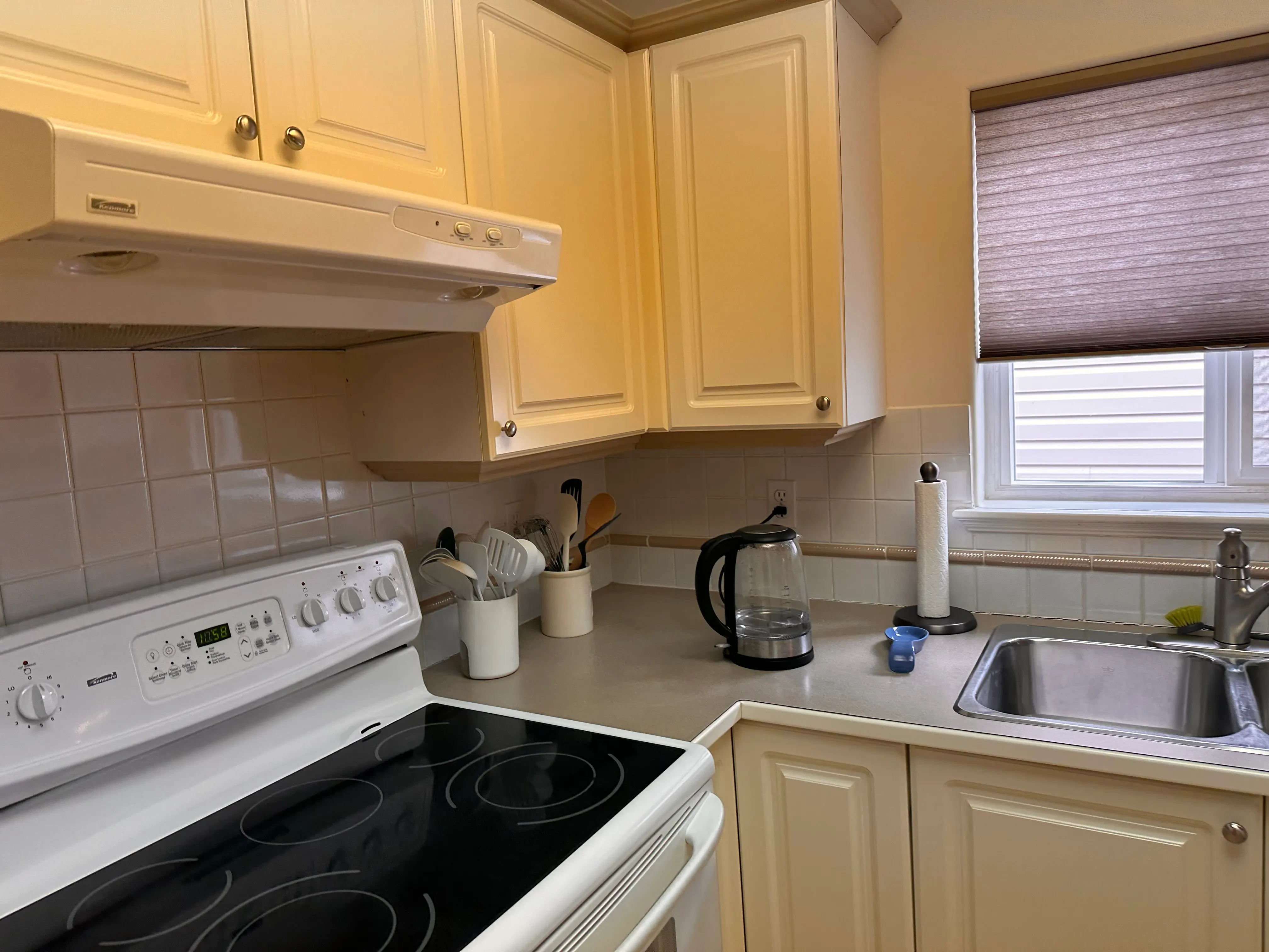 The original kitchen appliances and laminate counter up close