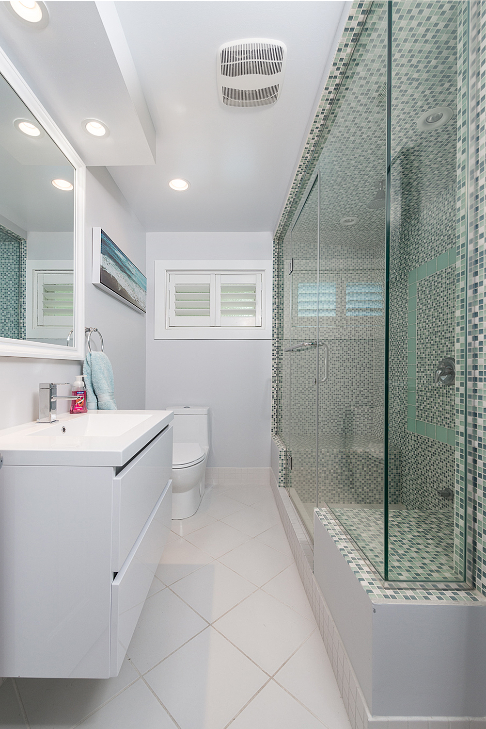 Mosaic tile bathroom with glass shower