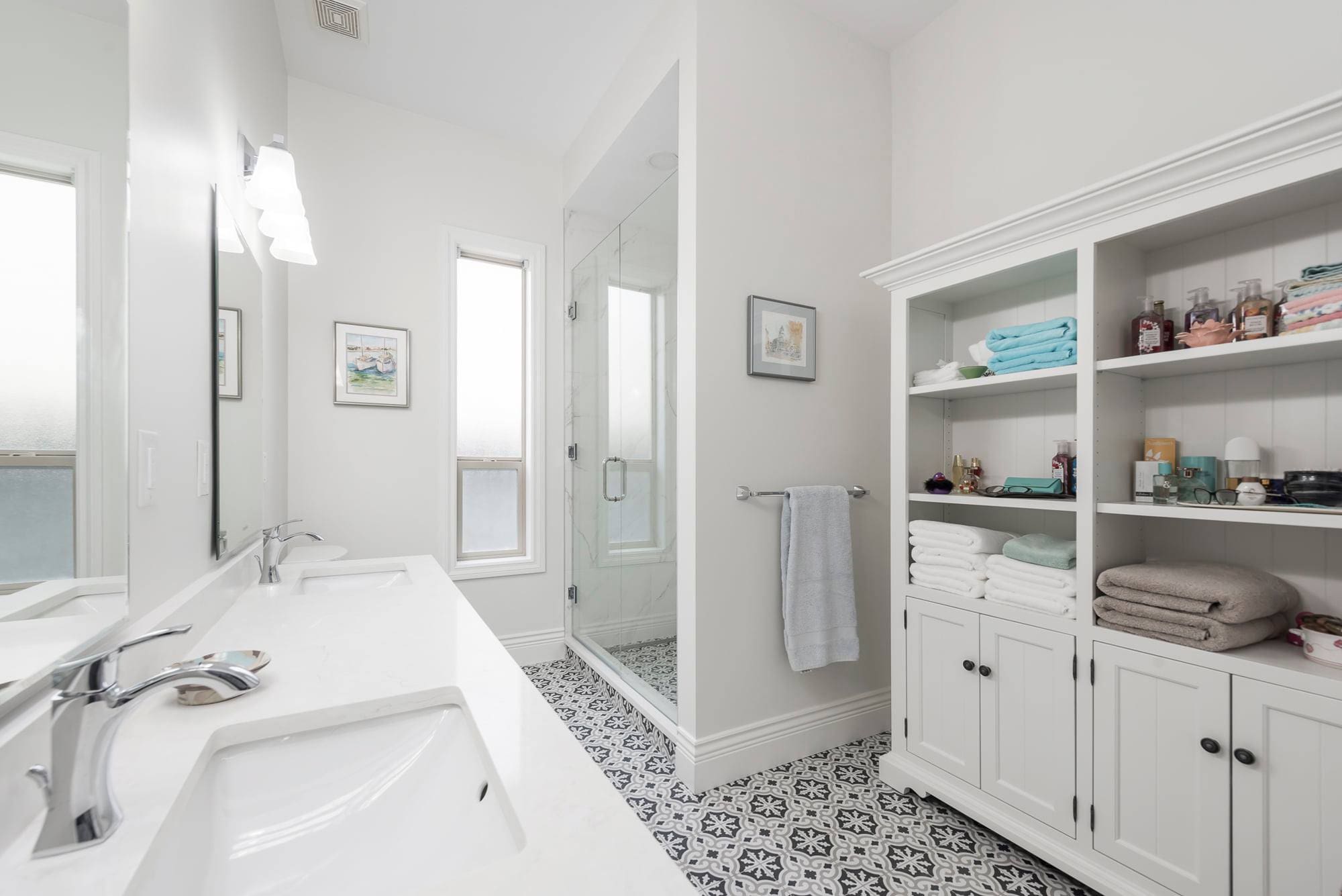 White bathroom with patterned tile floor