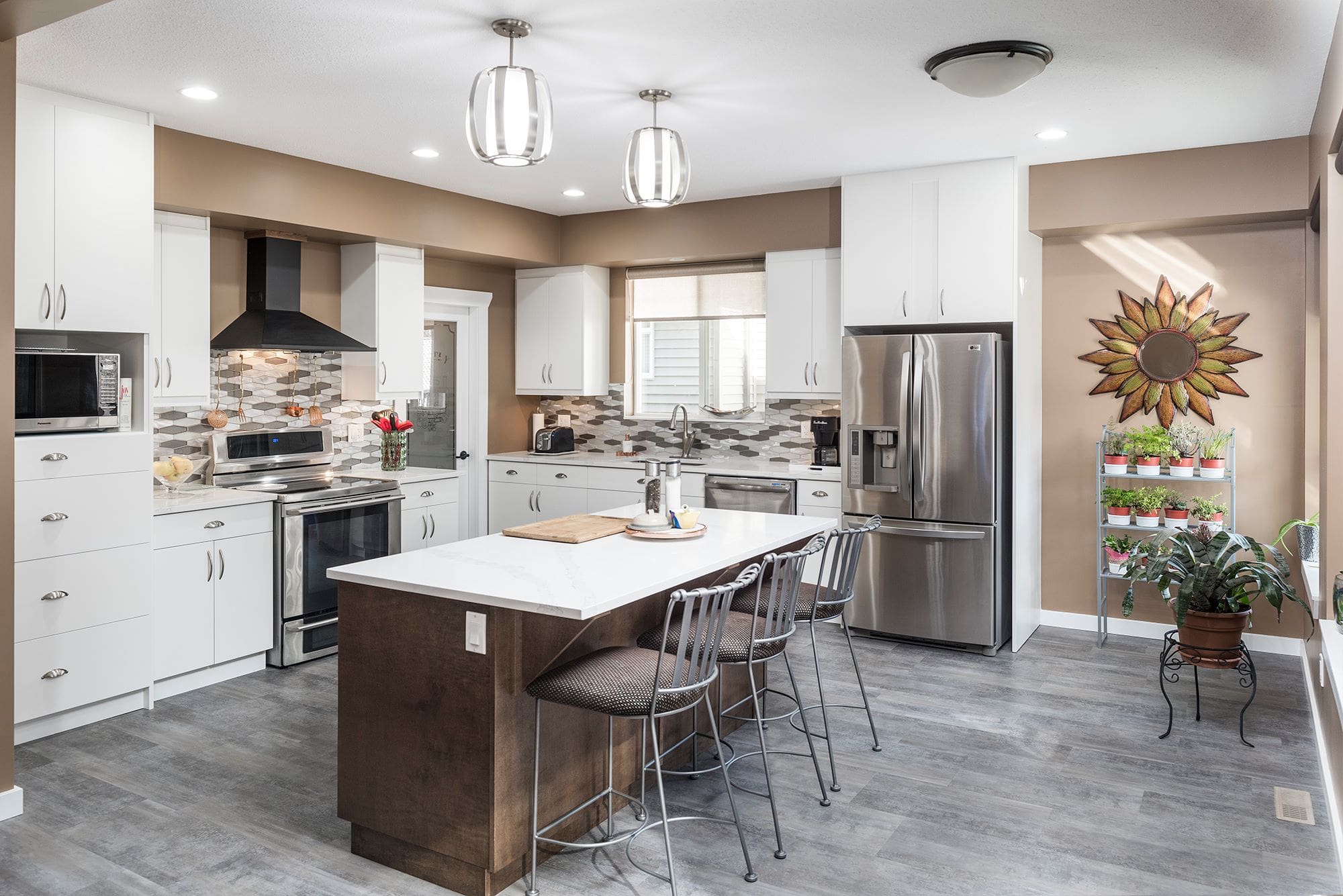 Kitchen with island and tile backsplash