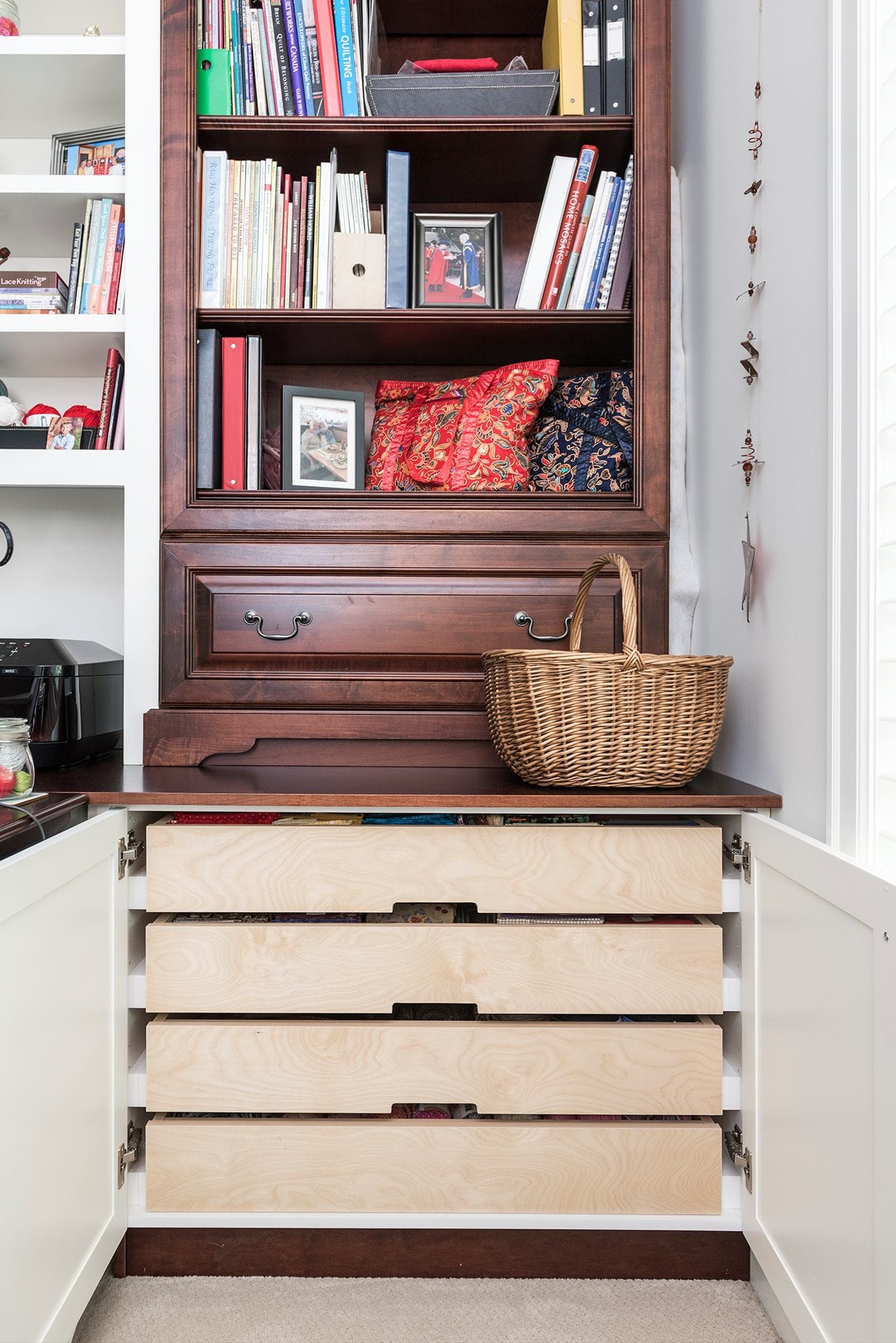 Custom bookshelf with pull-out storage drawers and craft organization Chilliwack BC