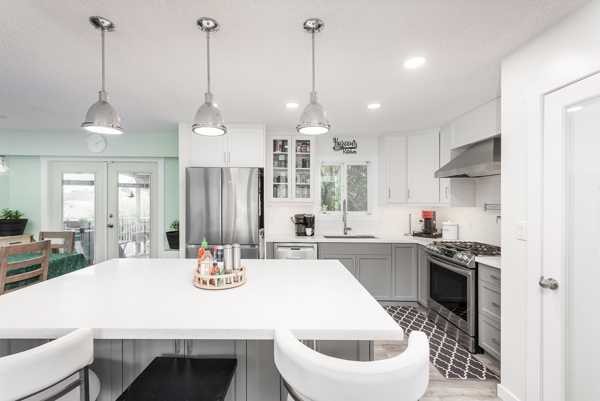 White and gray kitchen with pendant lights