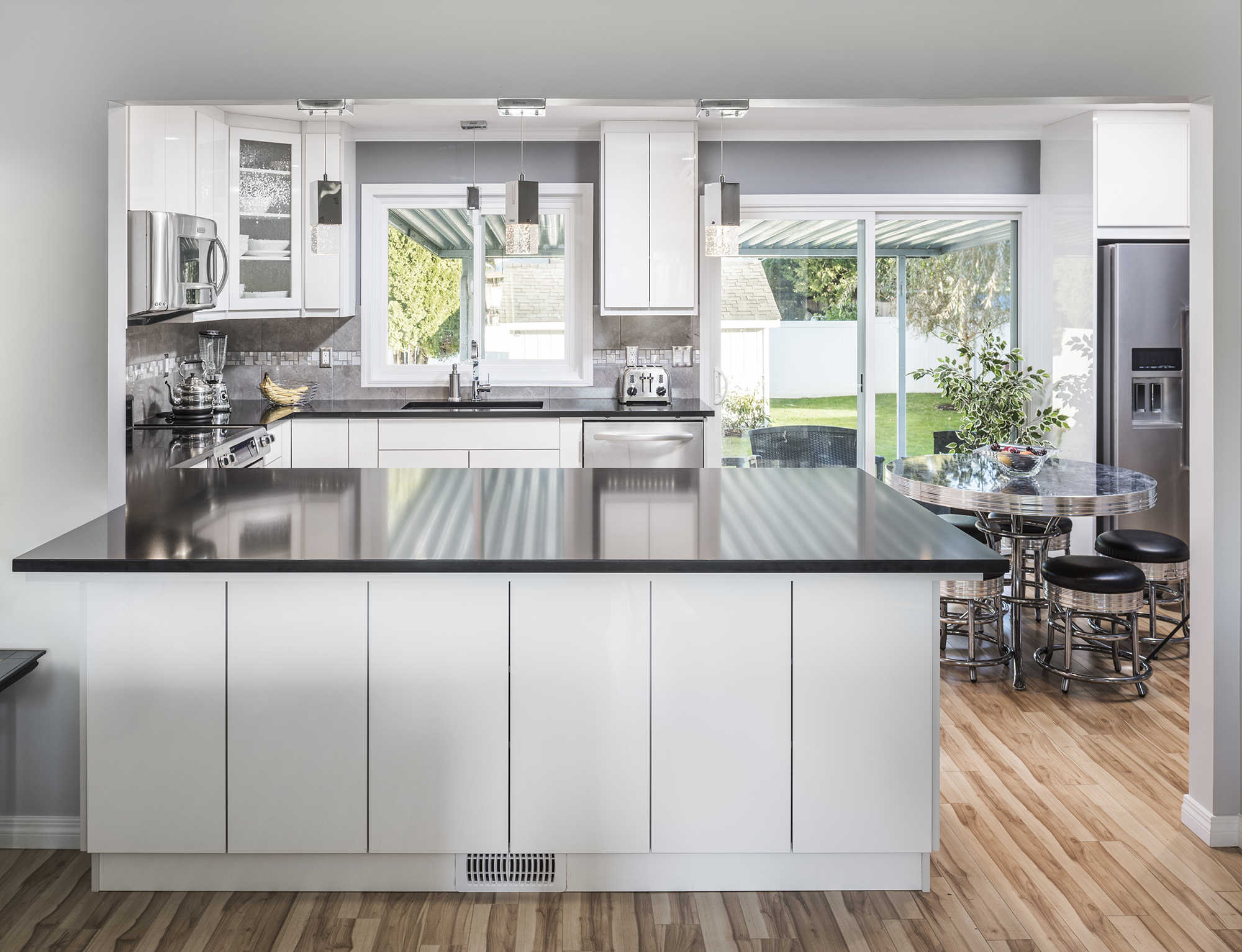White kitchen with black countertops