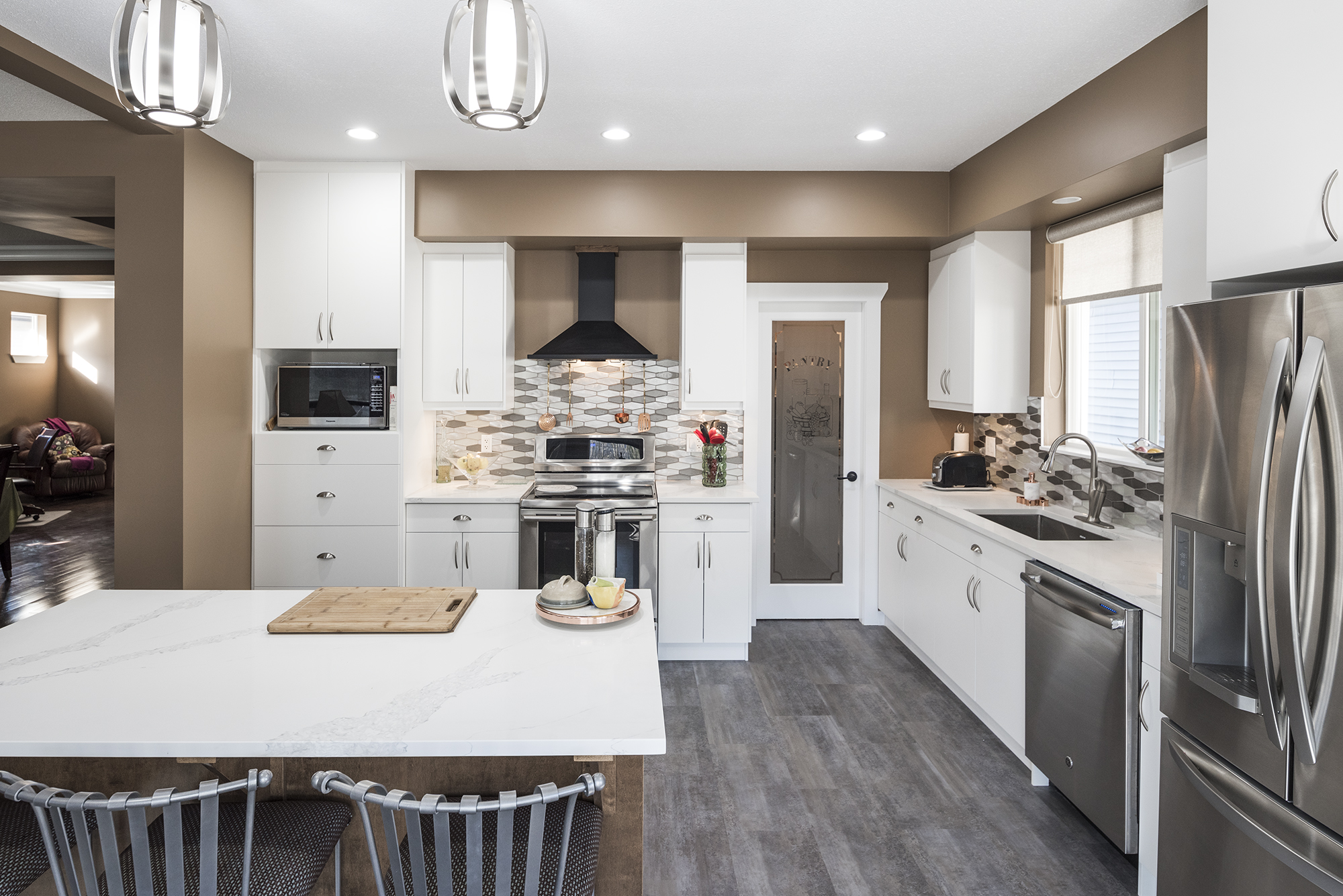 Modern kitchen with white cabinets and island