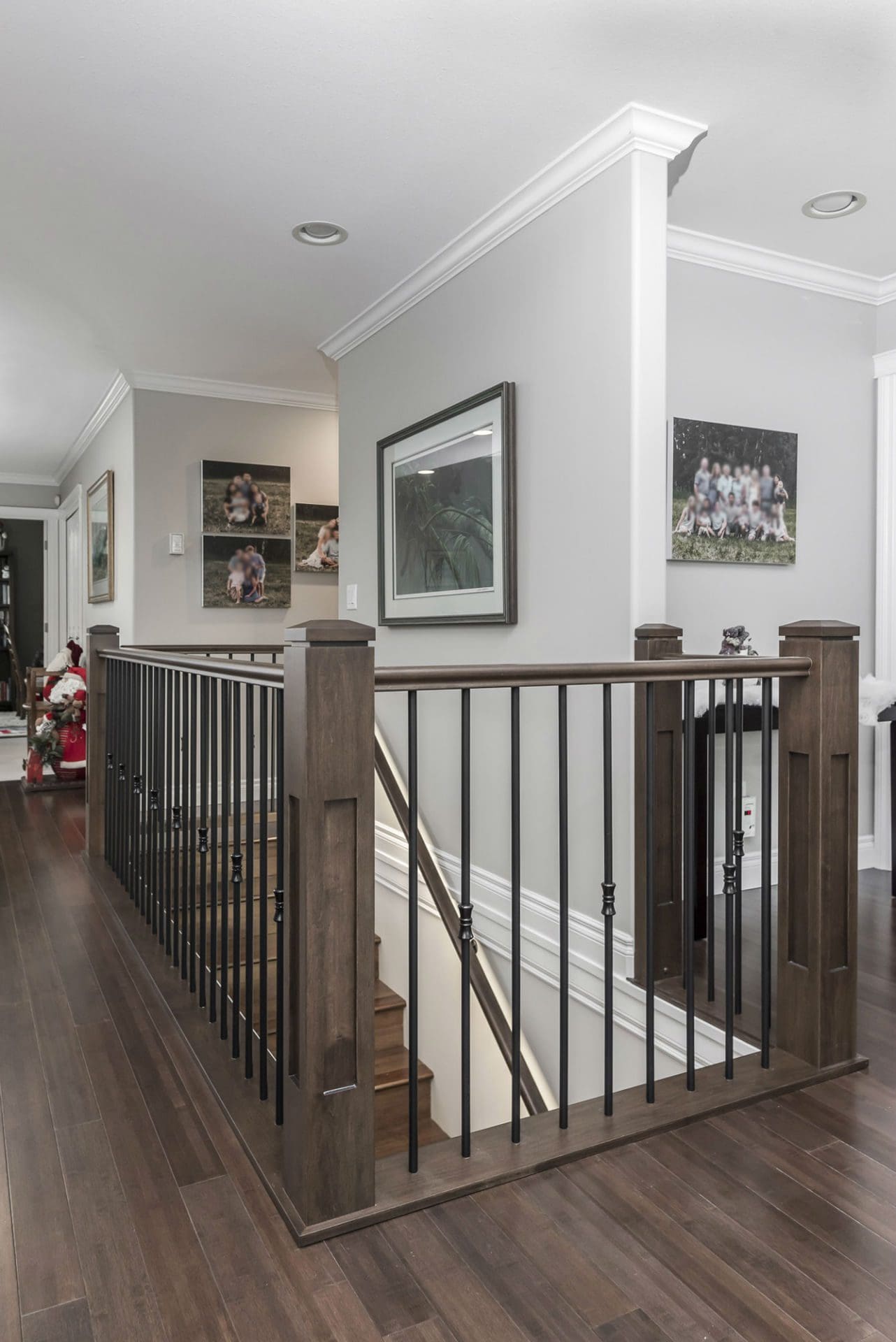 Wide staircase railing with gallery wall Chilliwack home renovation