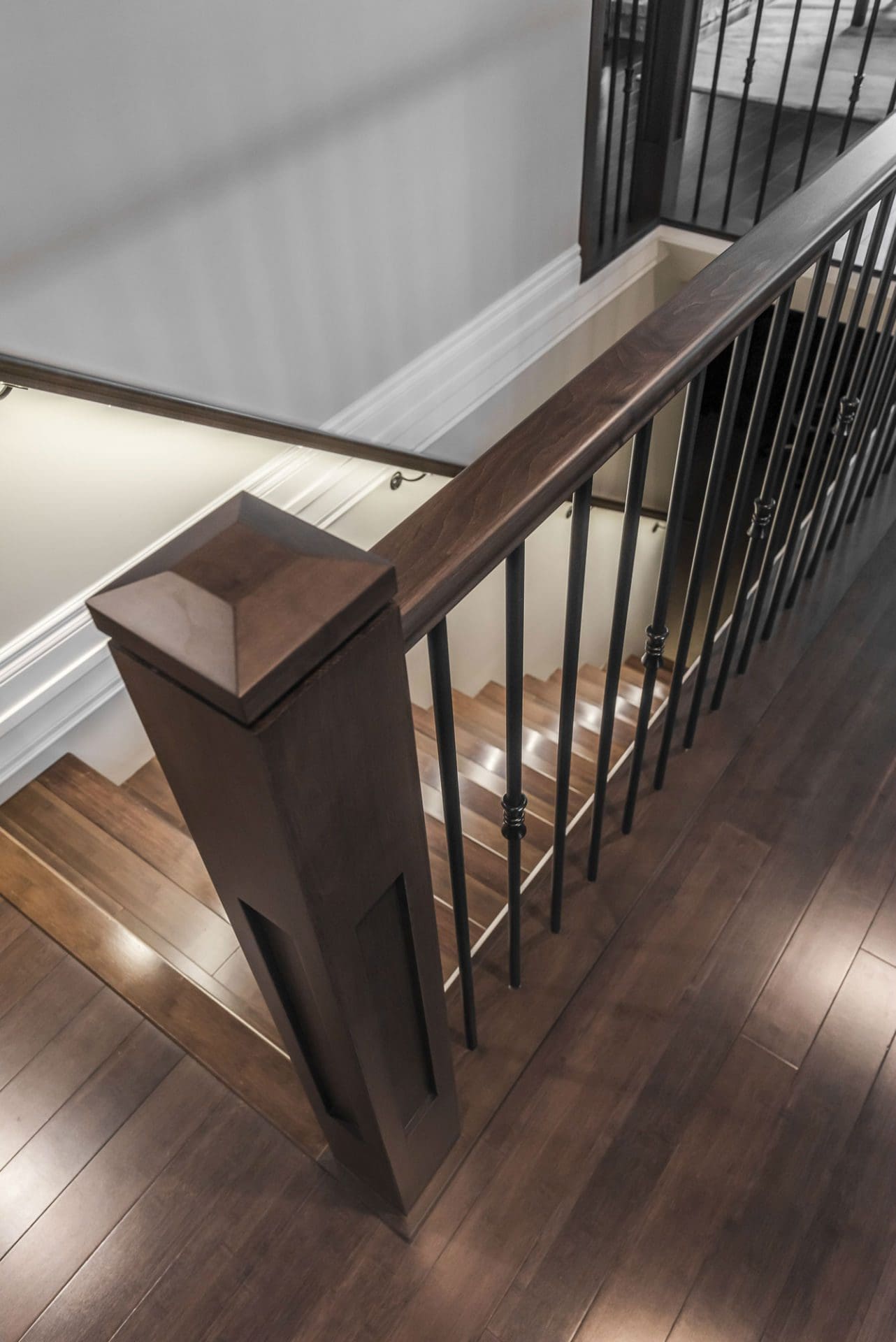 Staircase newel post with hardwood floors overhead view Chilliwack renovation