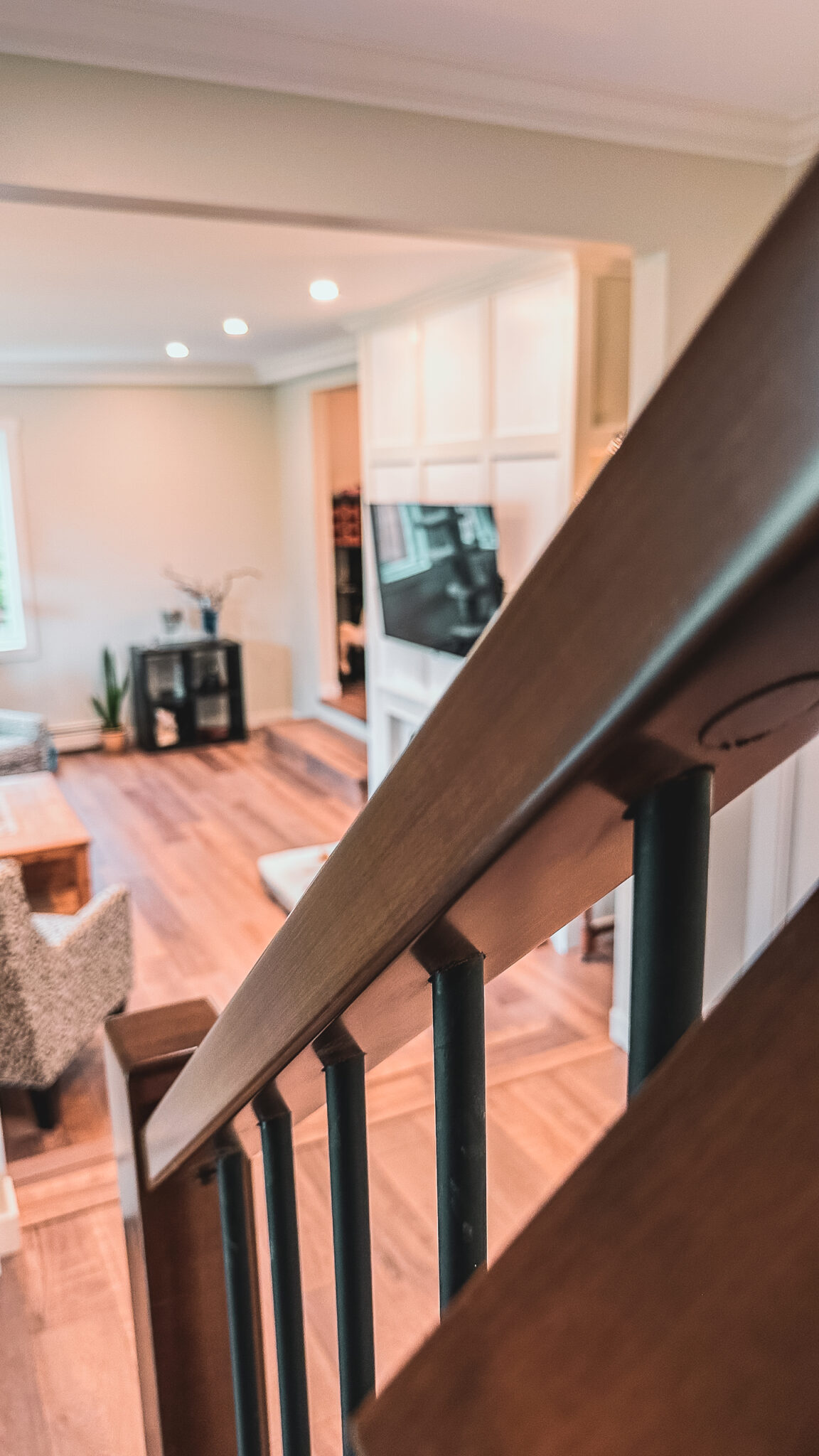 Stair railing overlooking open concept living room Yarrow BC