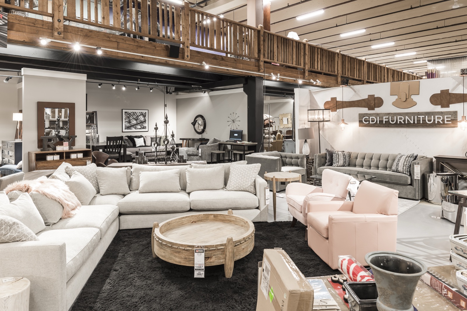 Modern retail showroom floor with styled displays and warm wood accents